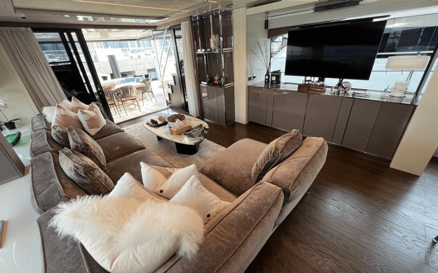 a dog lying on a couch aboard 2022 CRANCHI 78 Yacht for Sale