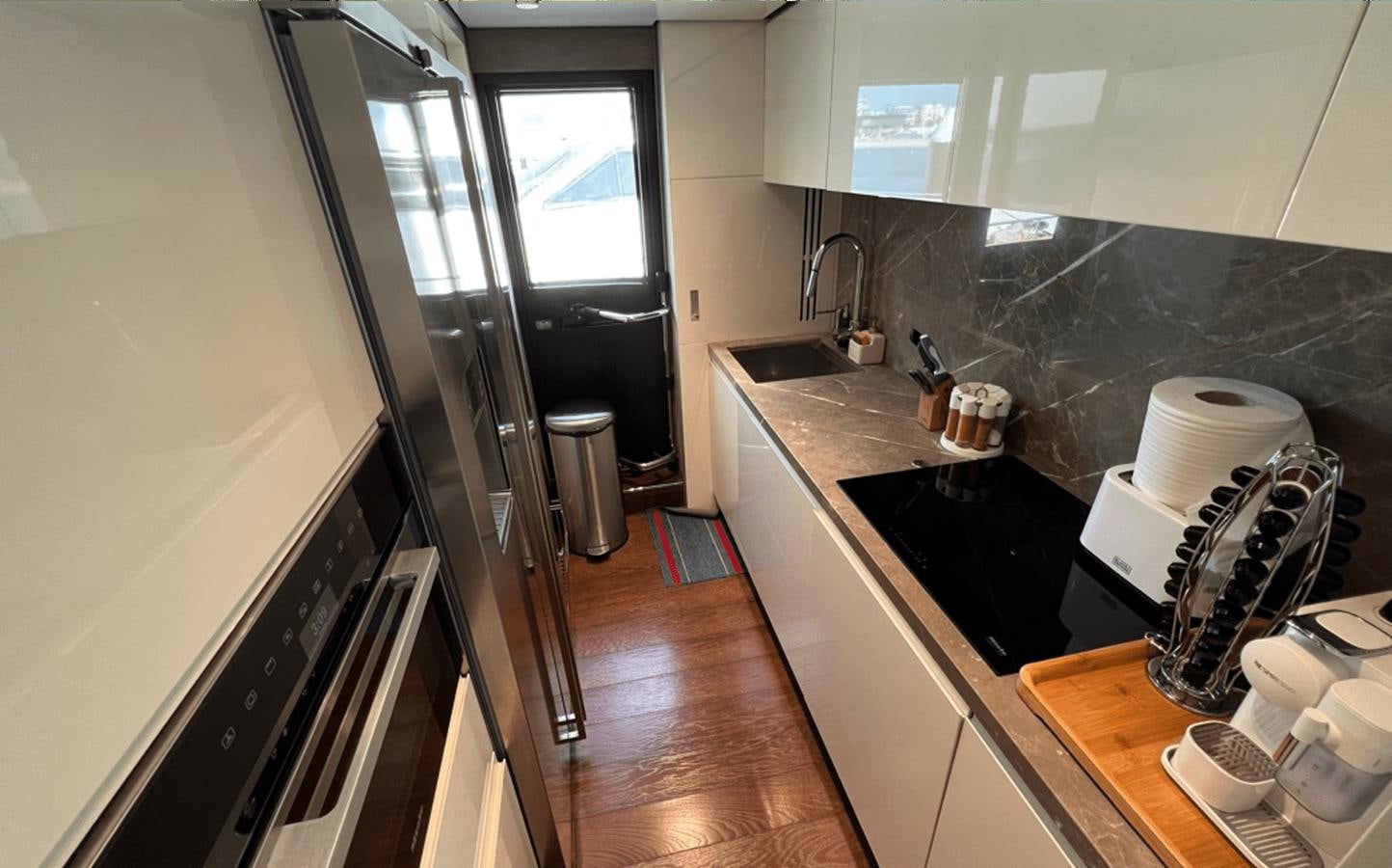 a kitchen with a sink and a counter aboard 2022 CRANCHI 78 Yacht for Sale