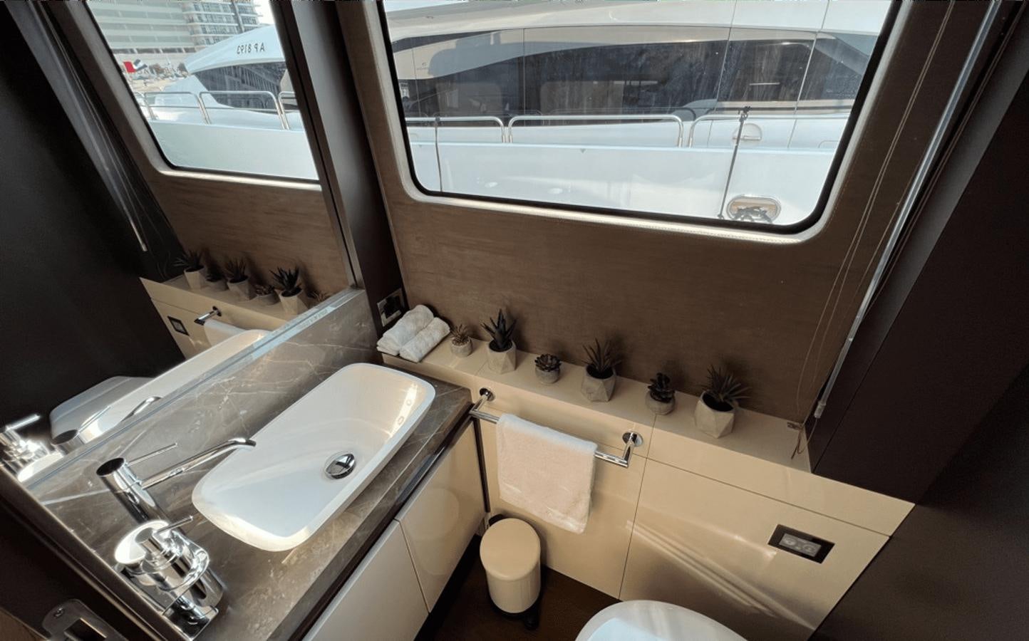 a bathroom with a large window aboard 2022 CRANCHI 78 Yacht for Sale