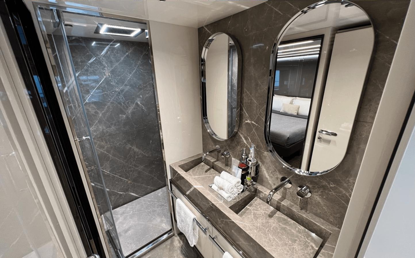 a bathroom with a large mirror aboard 2022 CRANCHI 78 Yacht for Sale