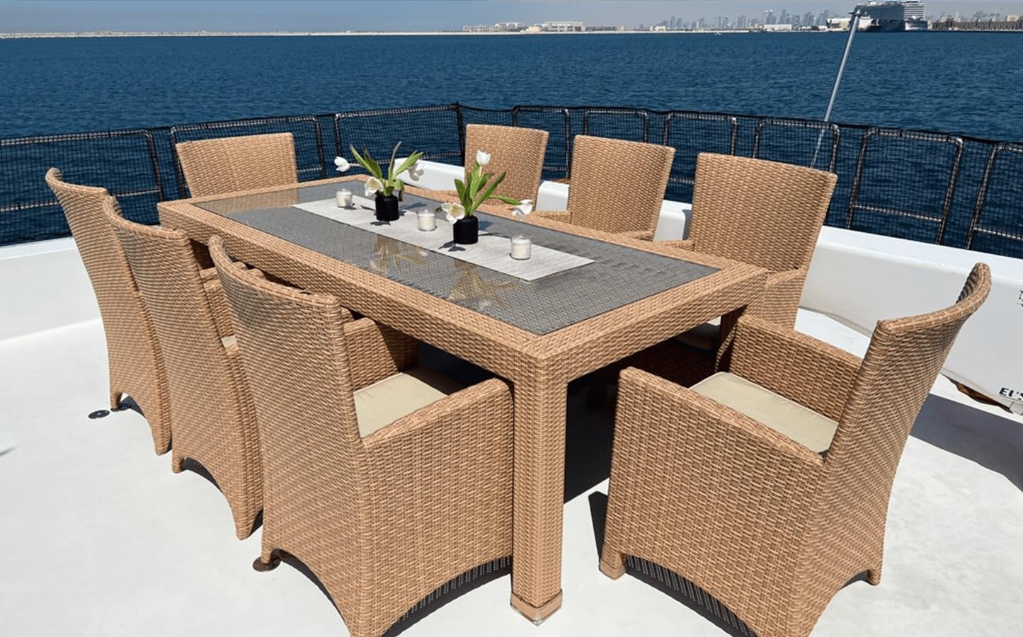 a table with chairs around it aboard 1998 HATTERAS 92 Yacht for Sale