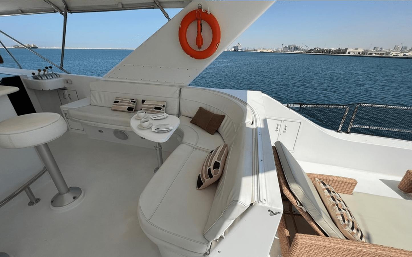 a boat on the water aboard 1998 HATTERAS 92 Yacht for Sale