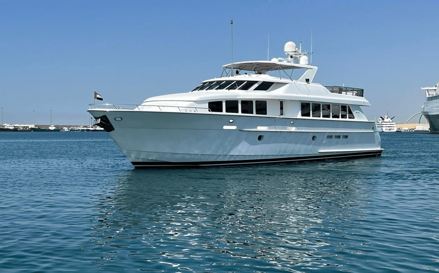 a boat in the water aboard 1998 HATTERAS 92 Yacht for Sale
