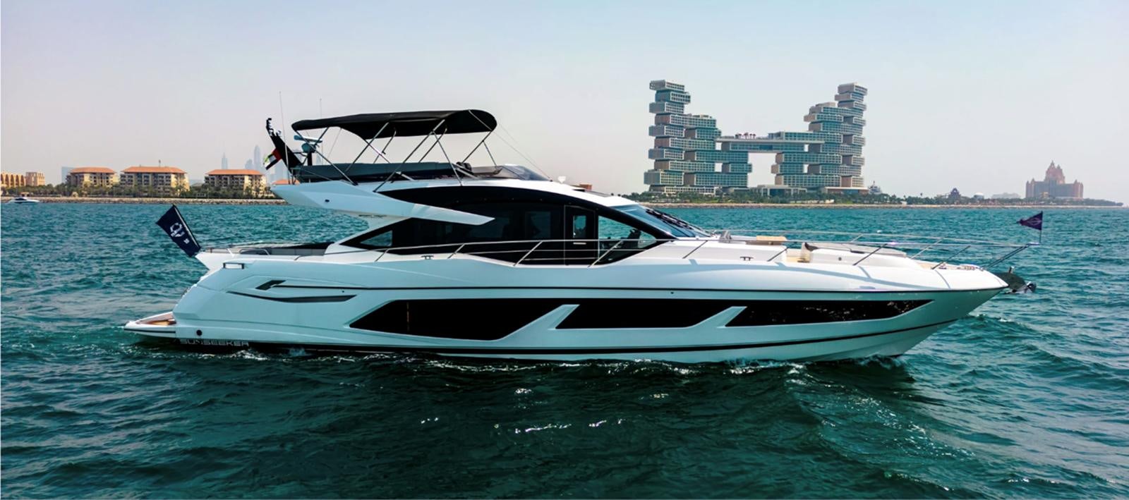 a boat in the water aboard 2023 SUNSEEKER 74 SPORTS  XPS Yacht for Sale