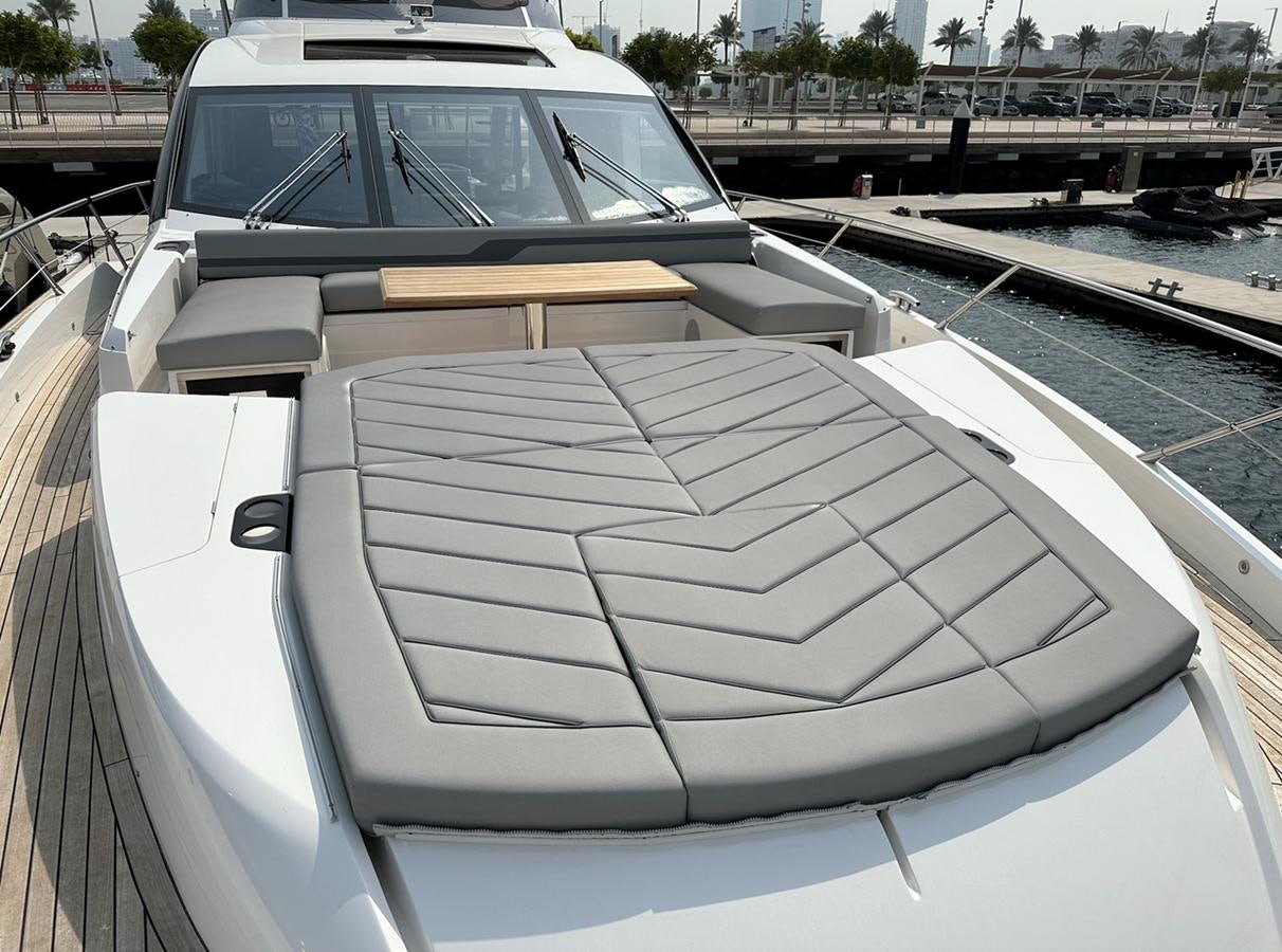 a car with a cover on the hood aboard 2023 SUNSEEKER 74 SPORTS  XPS Yacht for Sale