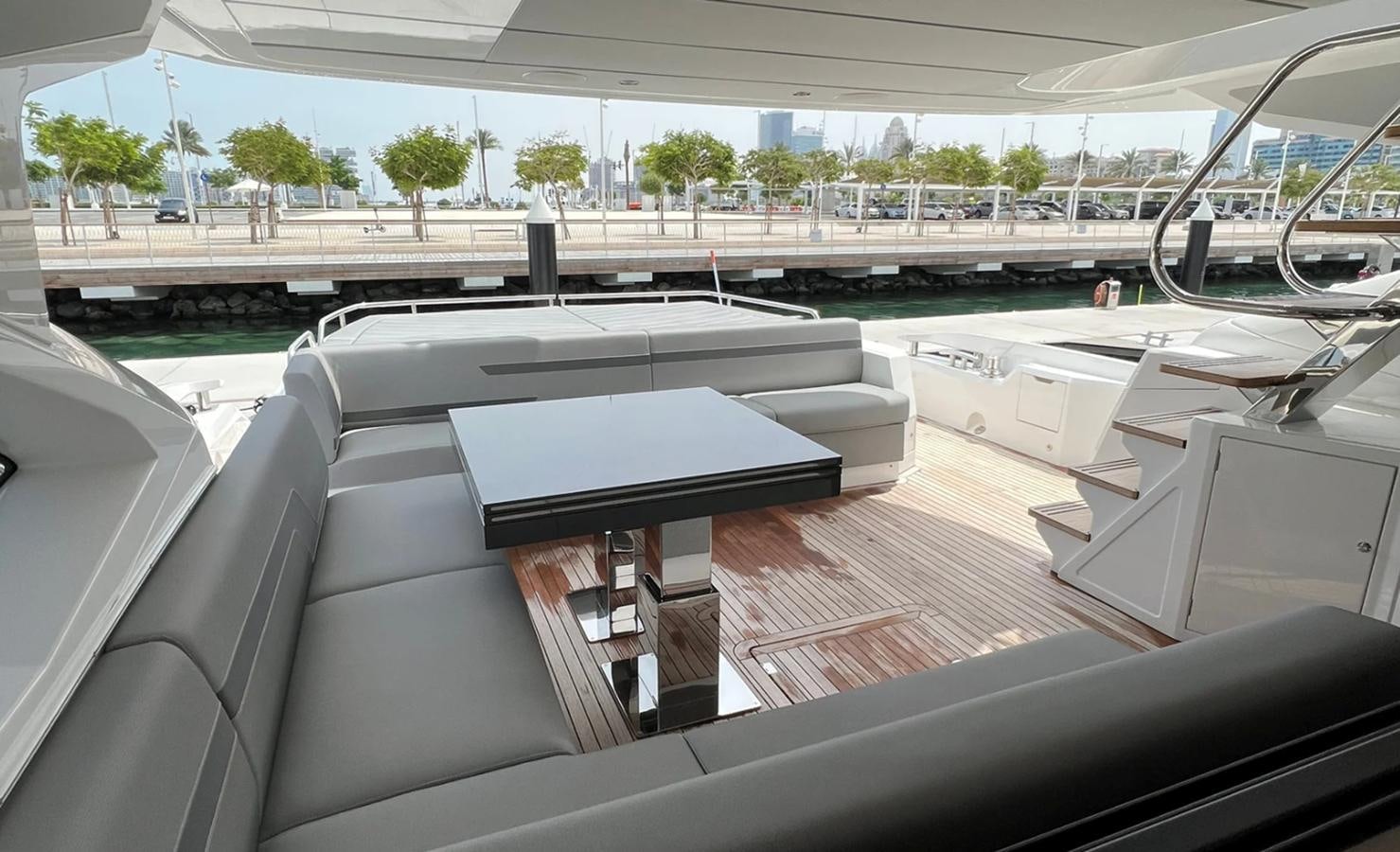 a room with a couch and a table aboard 2023 SUNSEEKER 74 SPORTS  XPS Yacht for Sale