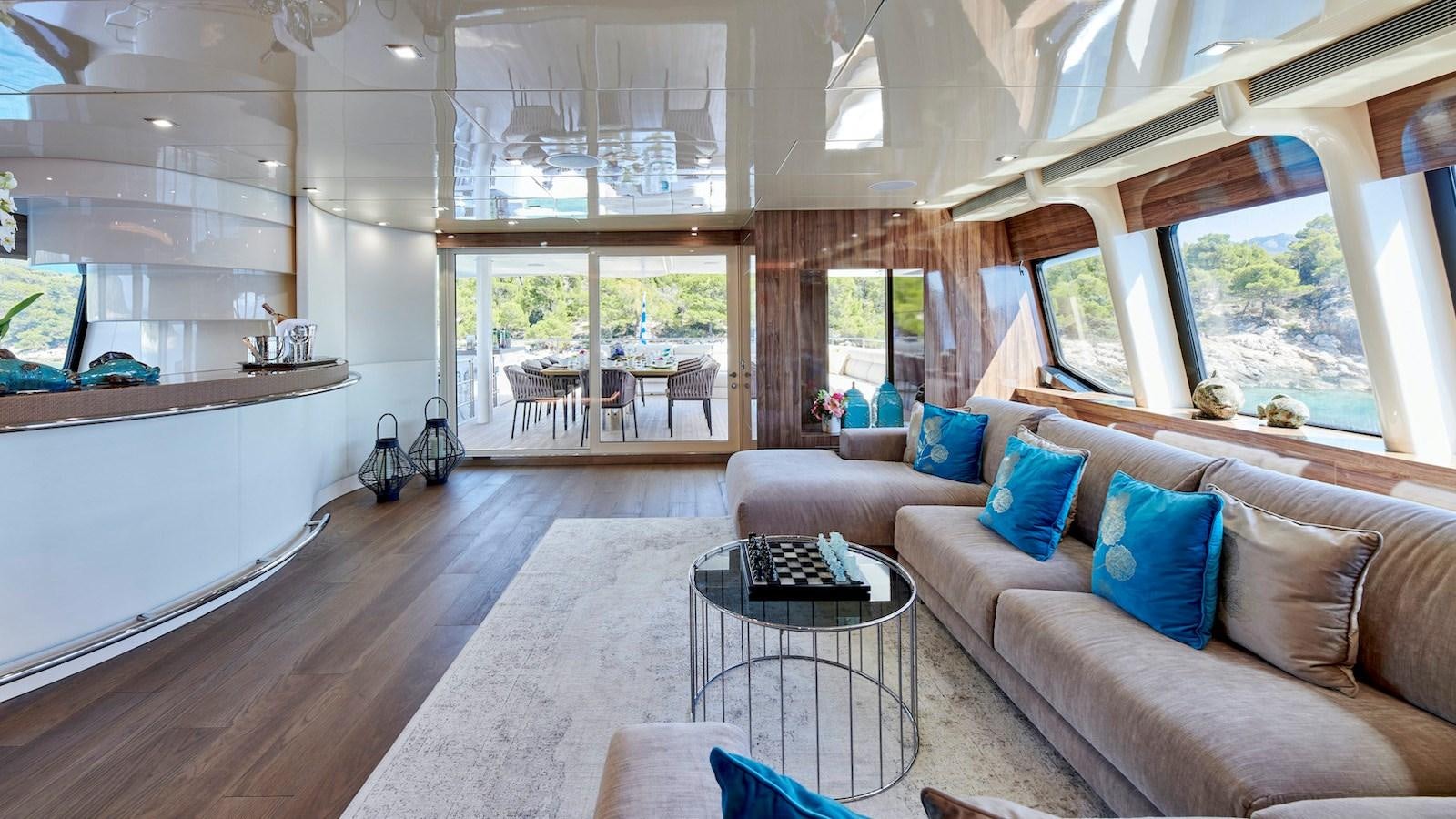 a living room with a couch and a table aboard DALOLI Yacht for Sale