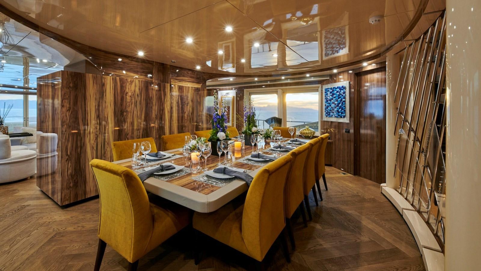 a dining room with a table and chairs aboard DALOLI Yacht for Sale