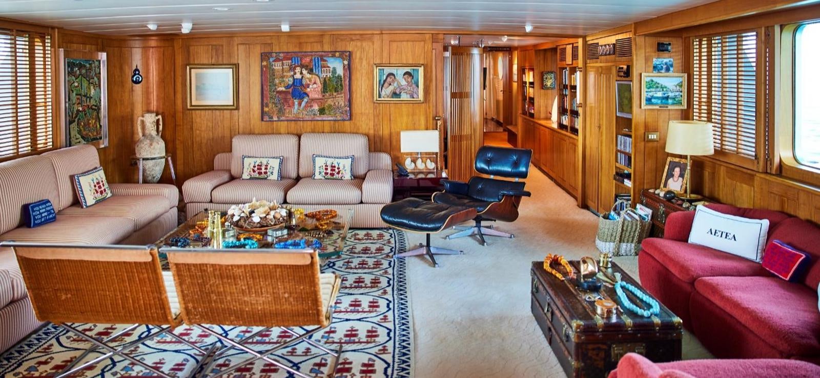 a living room with a couch and a table aboard AETEA Yacht for Sale