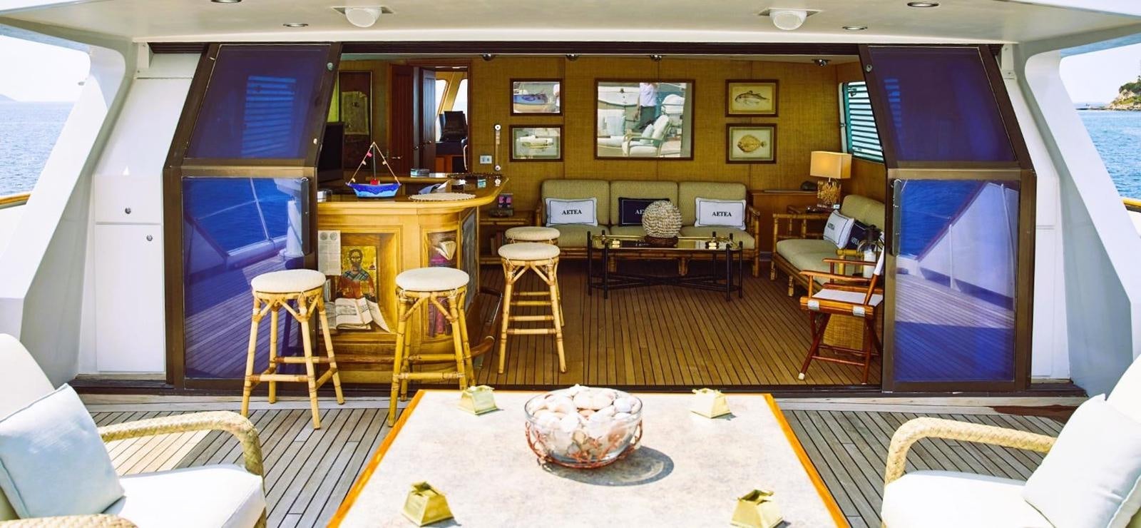 a room with a couch and chairs aboard AETEA Yacht for Sale