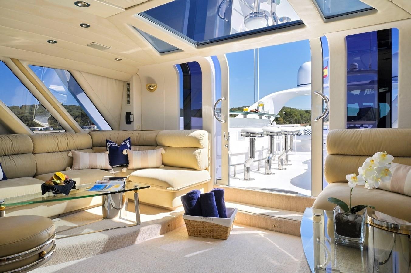 a living room with a large glass door aboard MOONRAKER Yacht for Sale