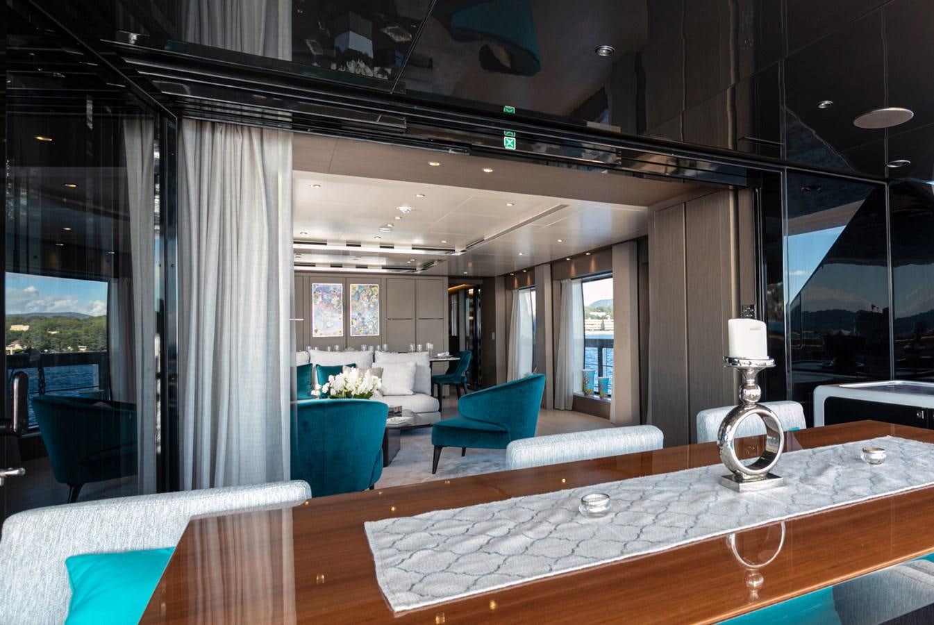 a large room with a table and chairs aboard JAG'B Yacht for Sale