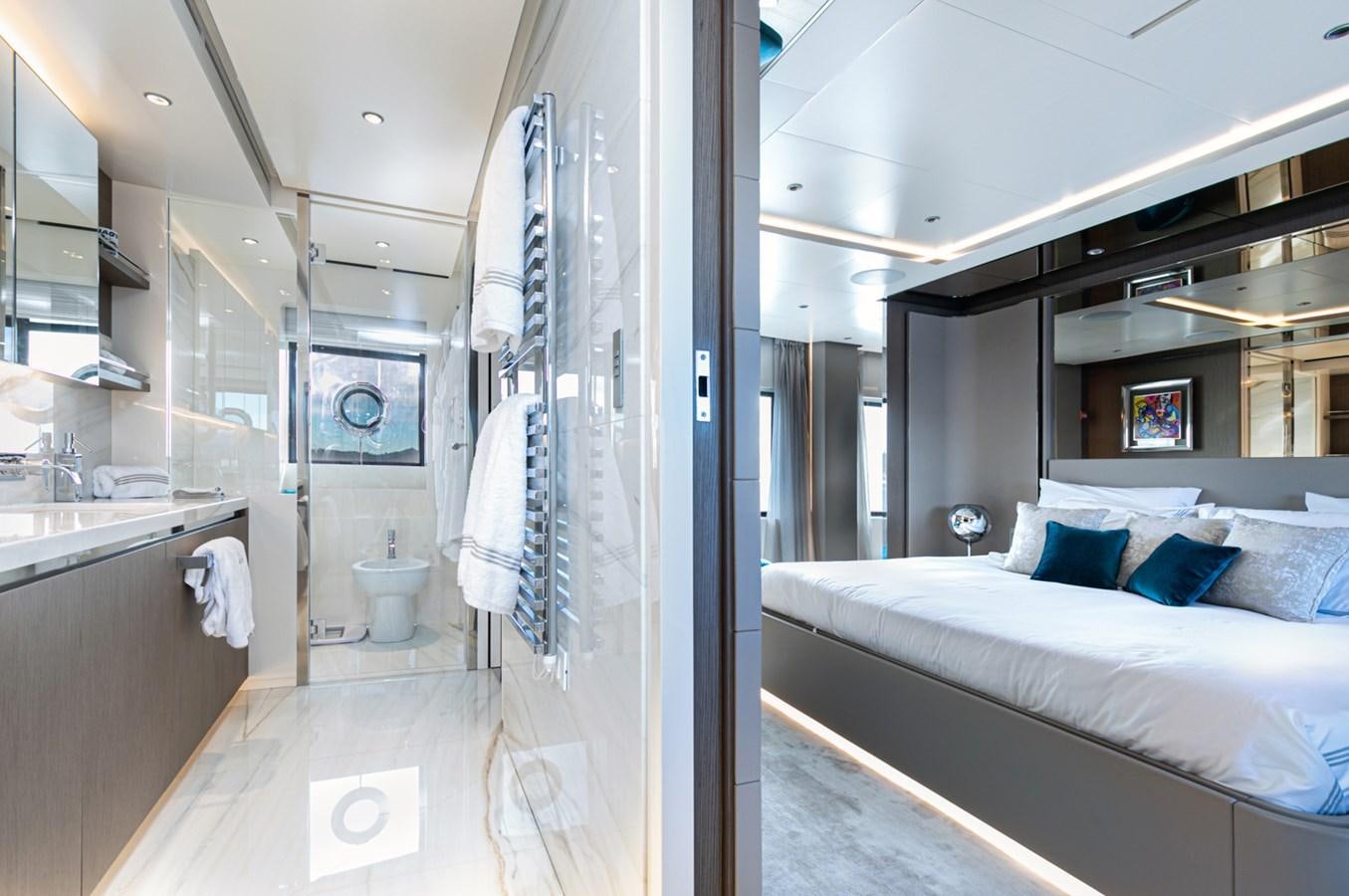 a bathroom with a bed and a sink aboard JAG'B Yacht for Sale