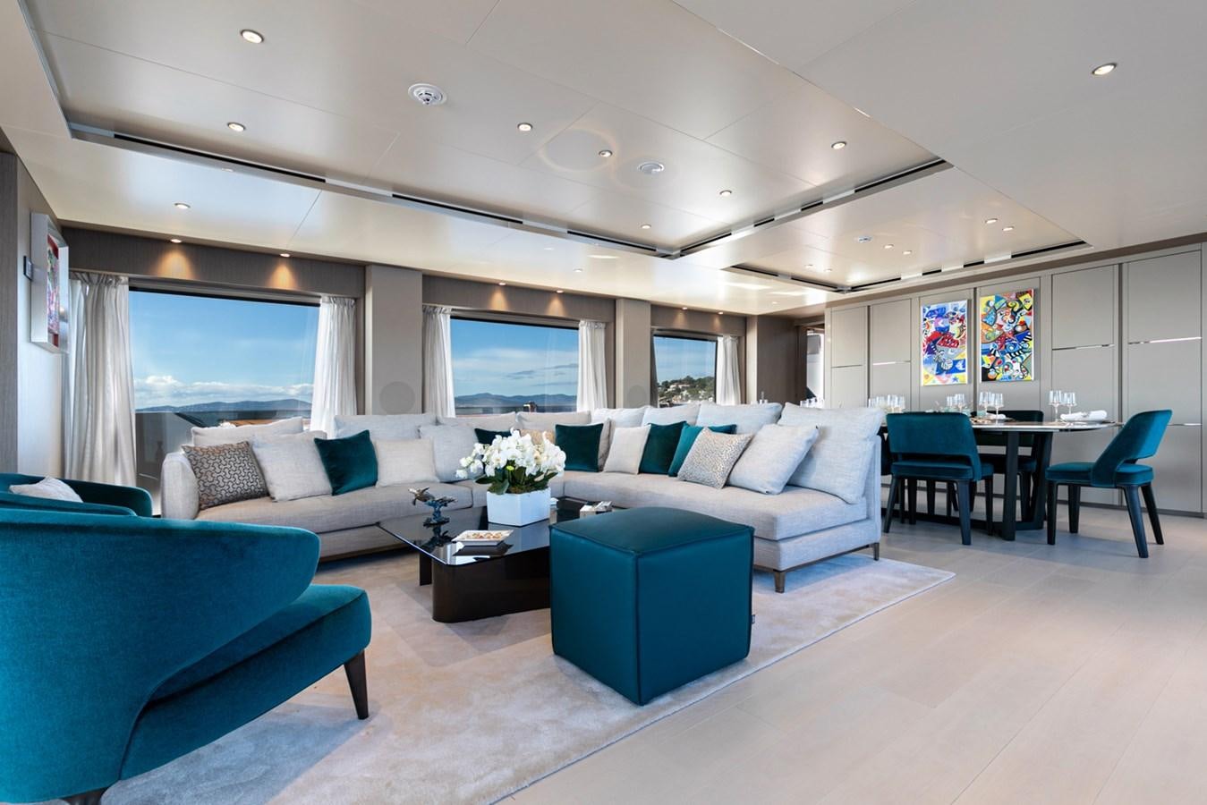 a living room with a couch and a table aboard JAG'B Yacht for Sale