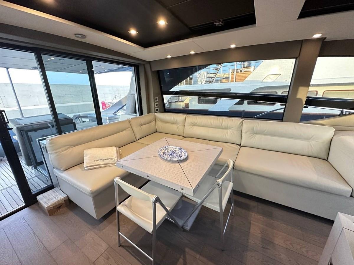 a living room with a couch and a table aboard SAAM 1 Yacht for Sale
