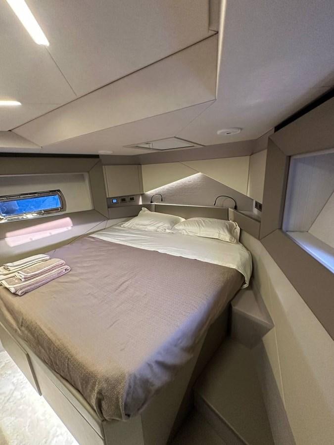 a bed in a room aboard SAAM 1 Yacht for Sale