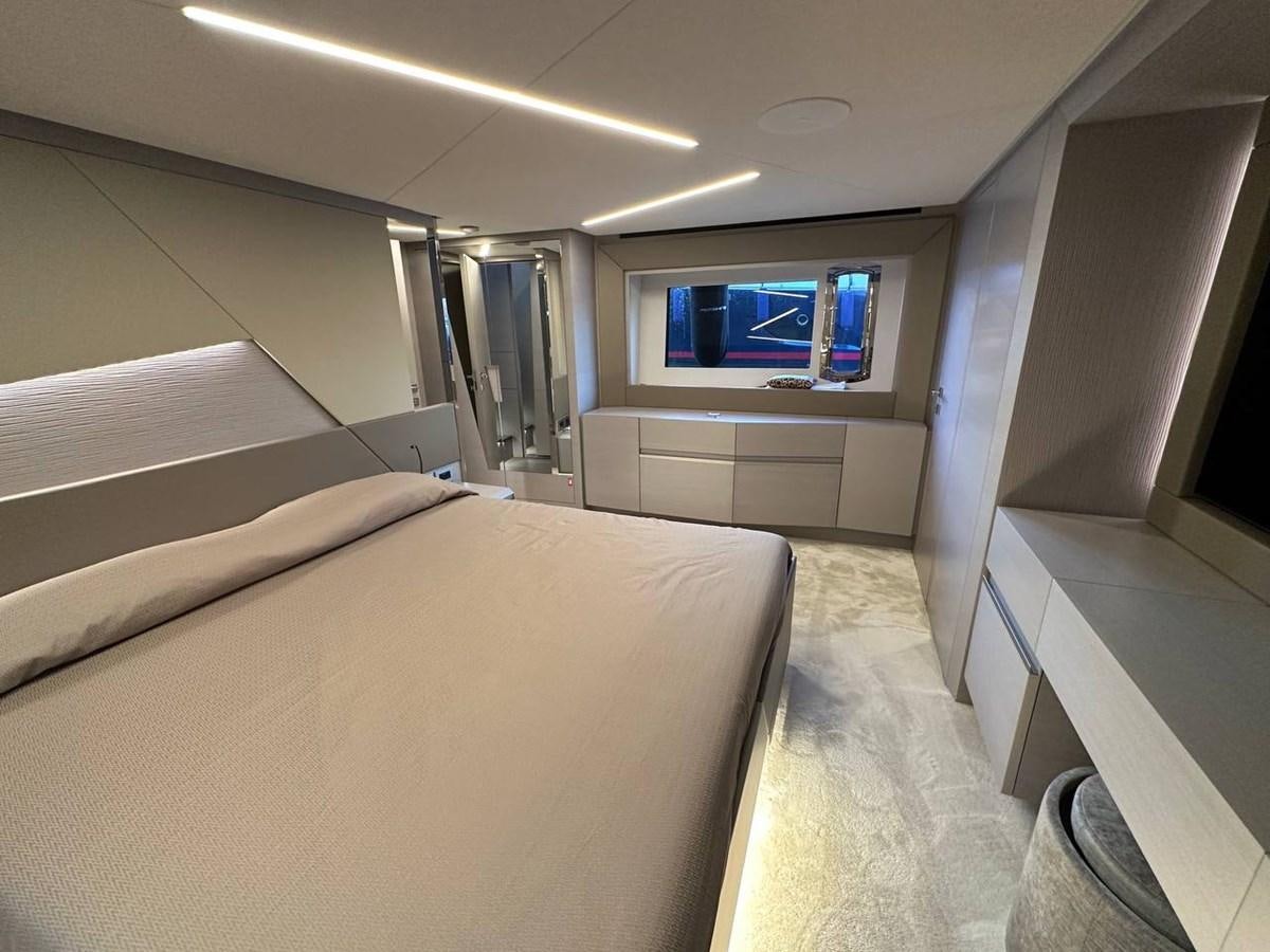 a room with a bed and a tv on the wall aboard SAAM 1 Yacht for Sale