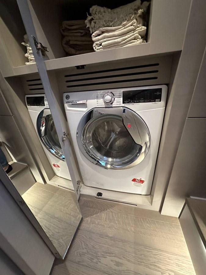 a washer and dryer in a room aboard SAAM 1 Yacht for Sale