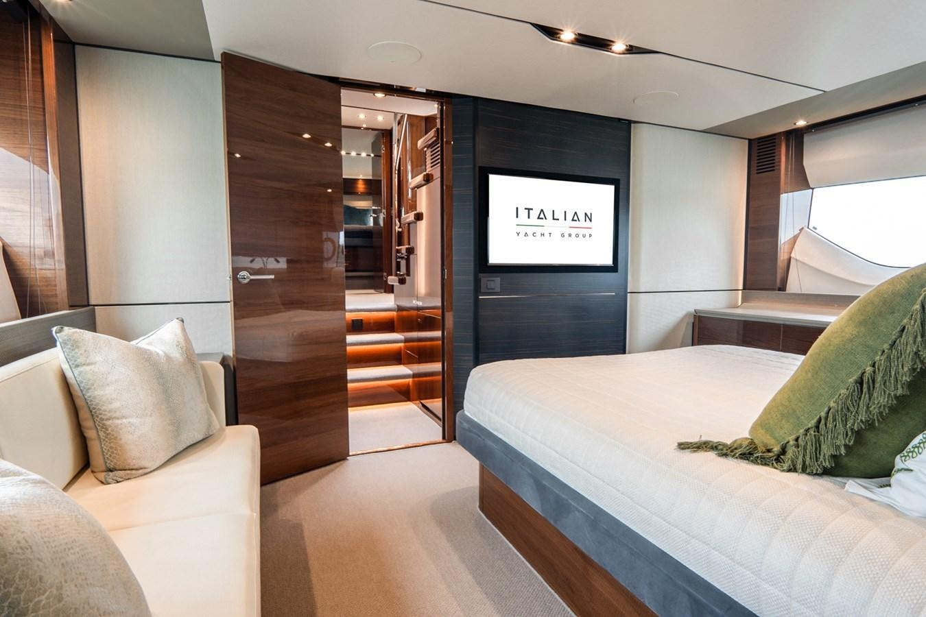 a room with a bed and a couch aboard CINDERELLA Yacht for Sale