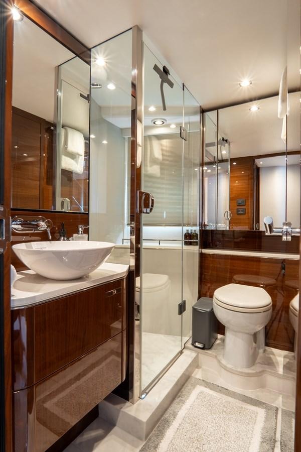 a bathroom with a glass shower aboard CINDERELLA Yacht for Sale