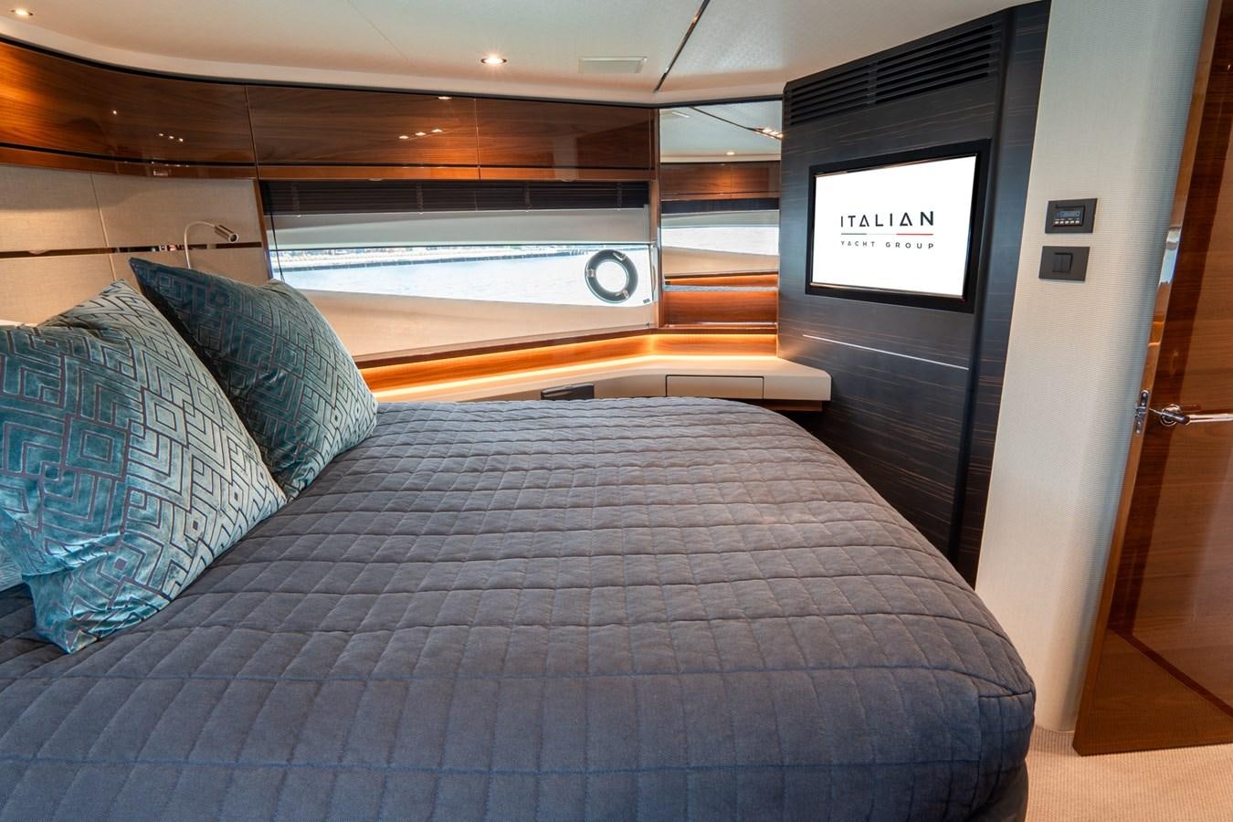a bed with a blue blanket aboard CINDERELLA Yacht for Sale