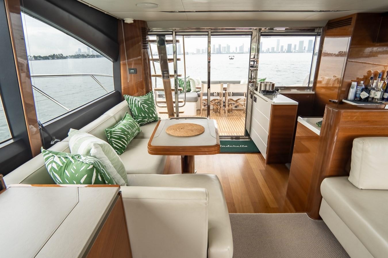 a living room with a view of the water aboard CINDERELLA Yacht for Sale