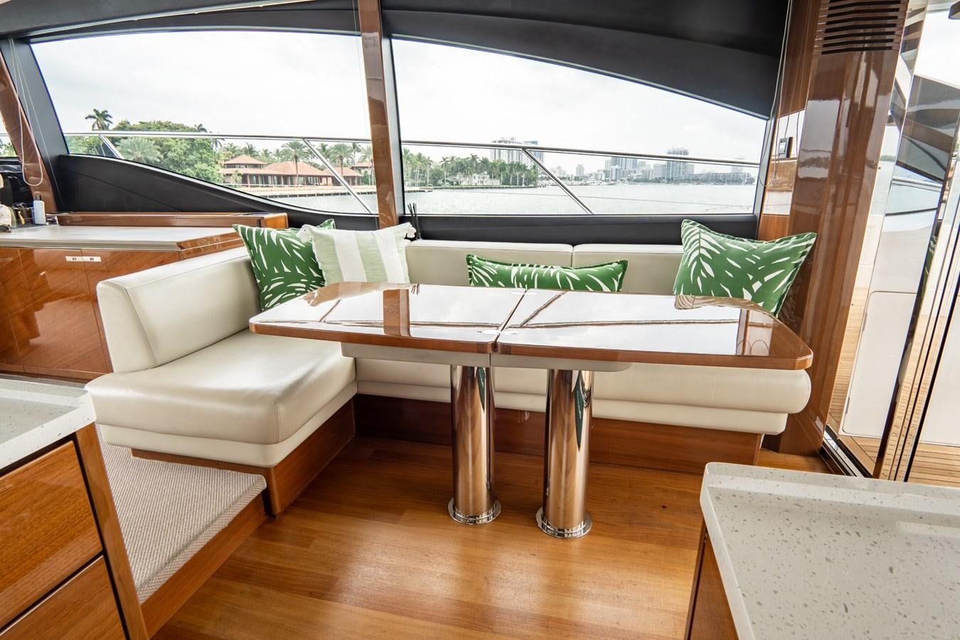 a table and chairs in a room aboard CINDERELLA Yacht for Sale