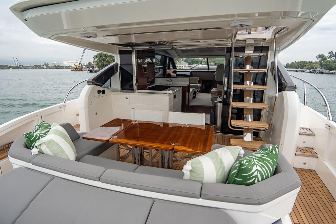 a boat with a table and chairs aboard CINDERELLA Yacht for Sale