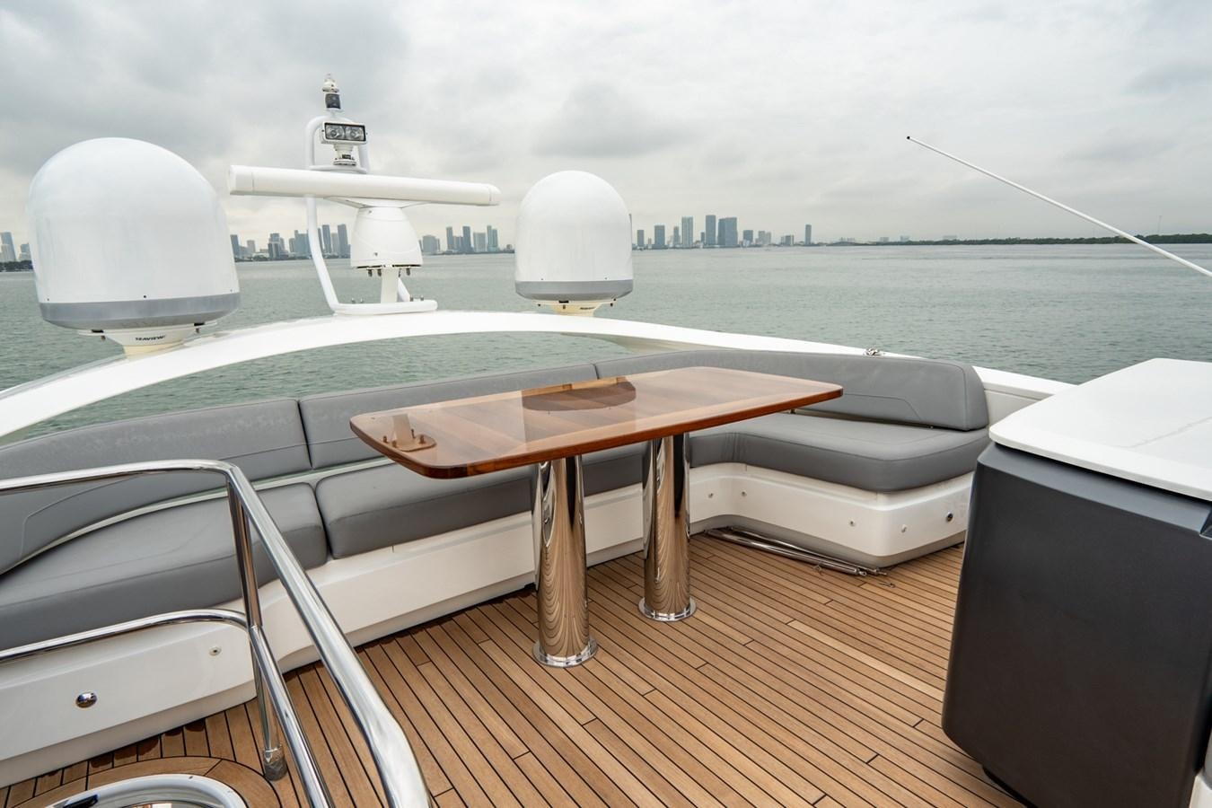 a table on a deck overlooking a body of water aboard CINDERELLA Yacht for Sale