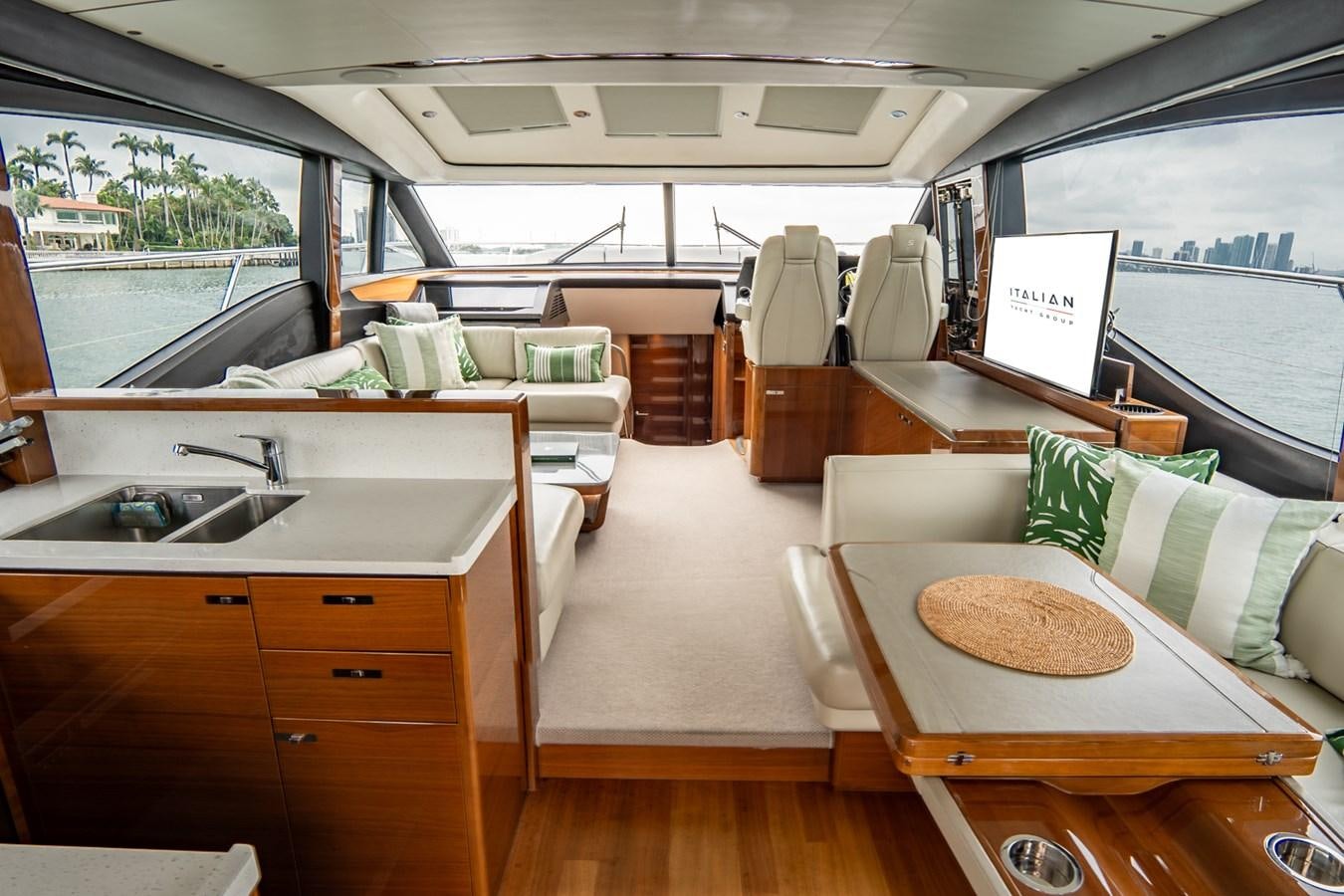 a room with a table and chairs aboard CINDERELLA Yacht for Sale