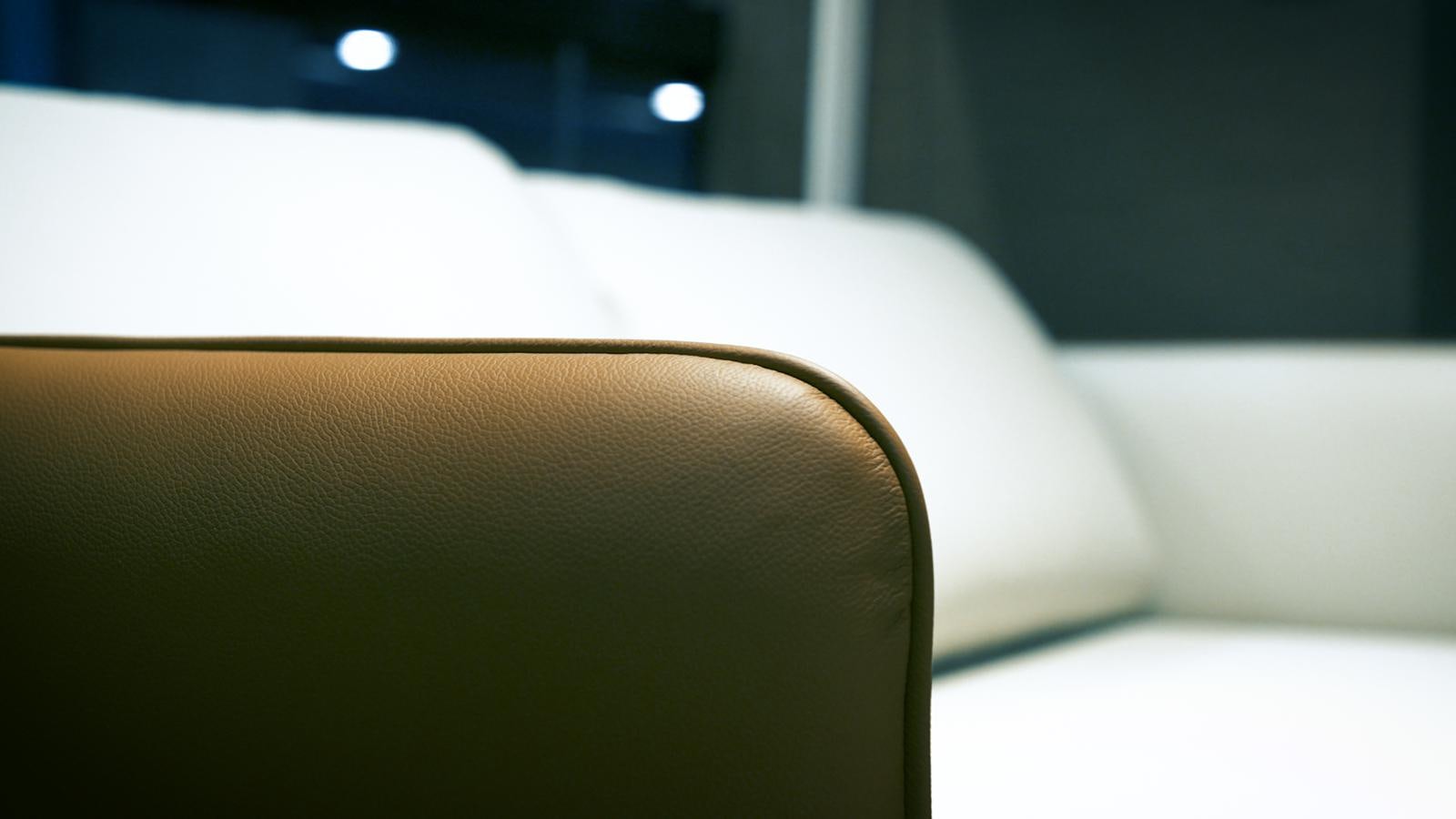 a leather chair in a room aboard 2024 PRESTIGE X-LINE X70 Yacht for Sale