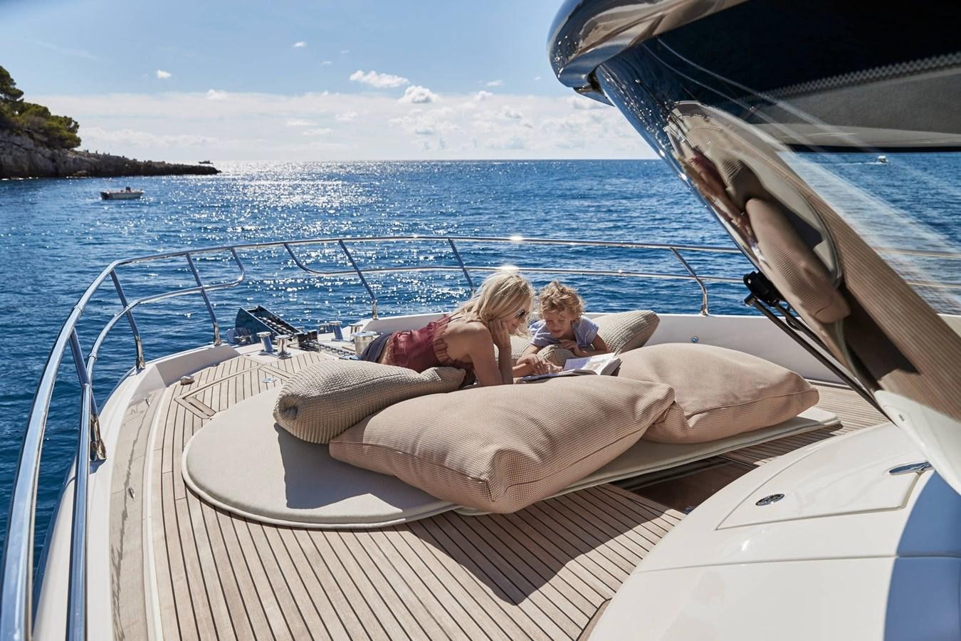 a group of people on a boat aboard 2024 PRESTIGE X-LINE X70 Yacht for Sale