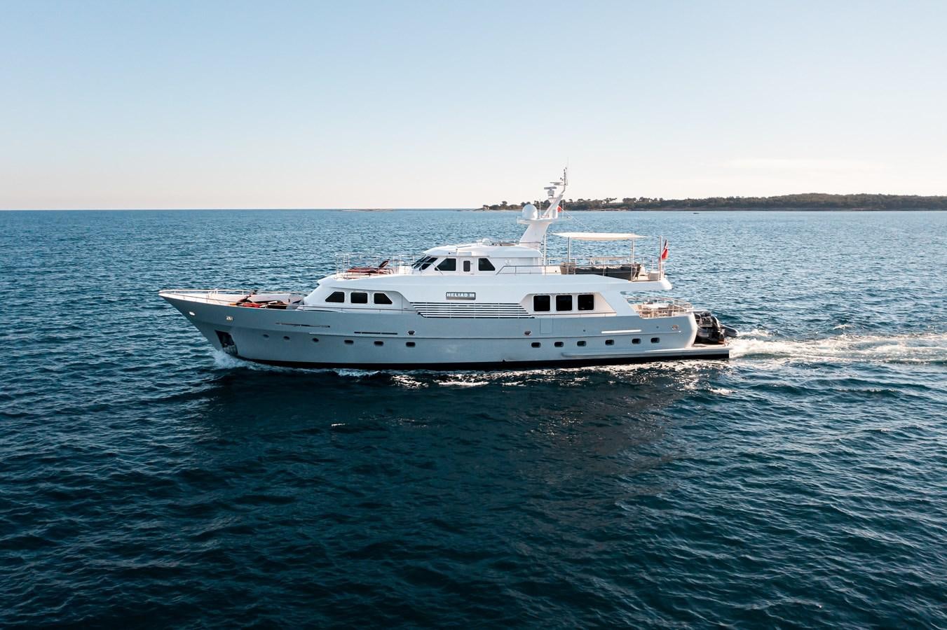 a white boat in the water aboard HELIAD III Yacht for Sale