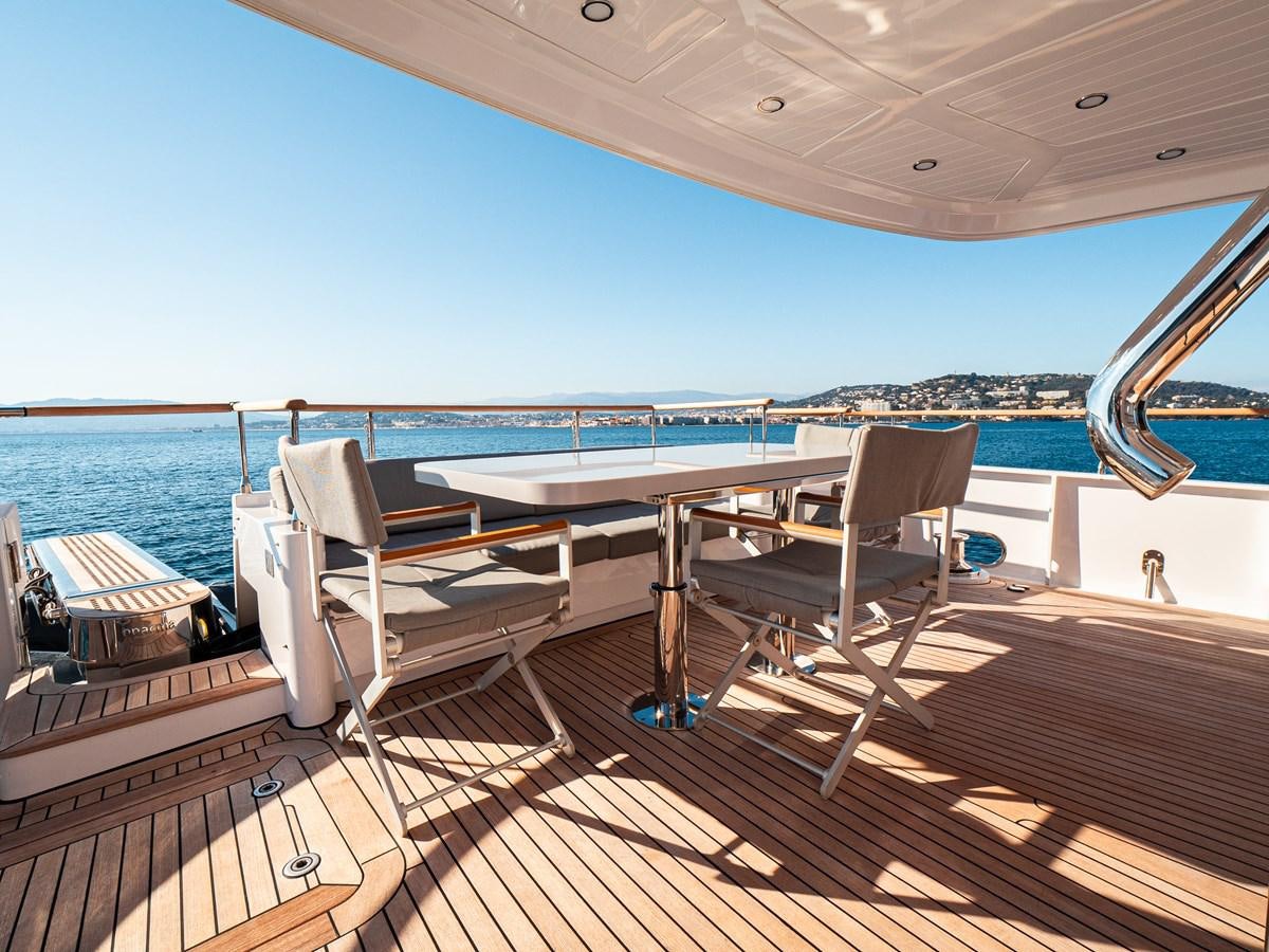 a deck with a view of the ocean and a deck aboard HELIAD III Yacht for Sale