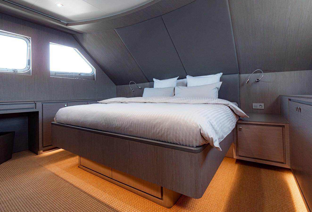a bed in a room aboard HELIAD III Yacht for Sale