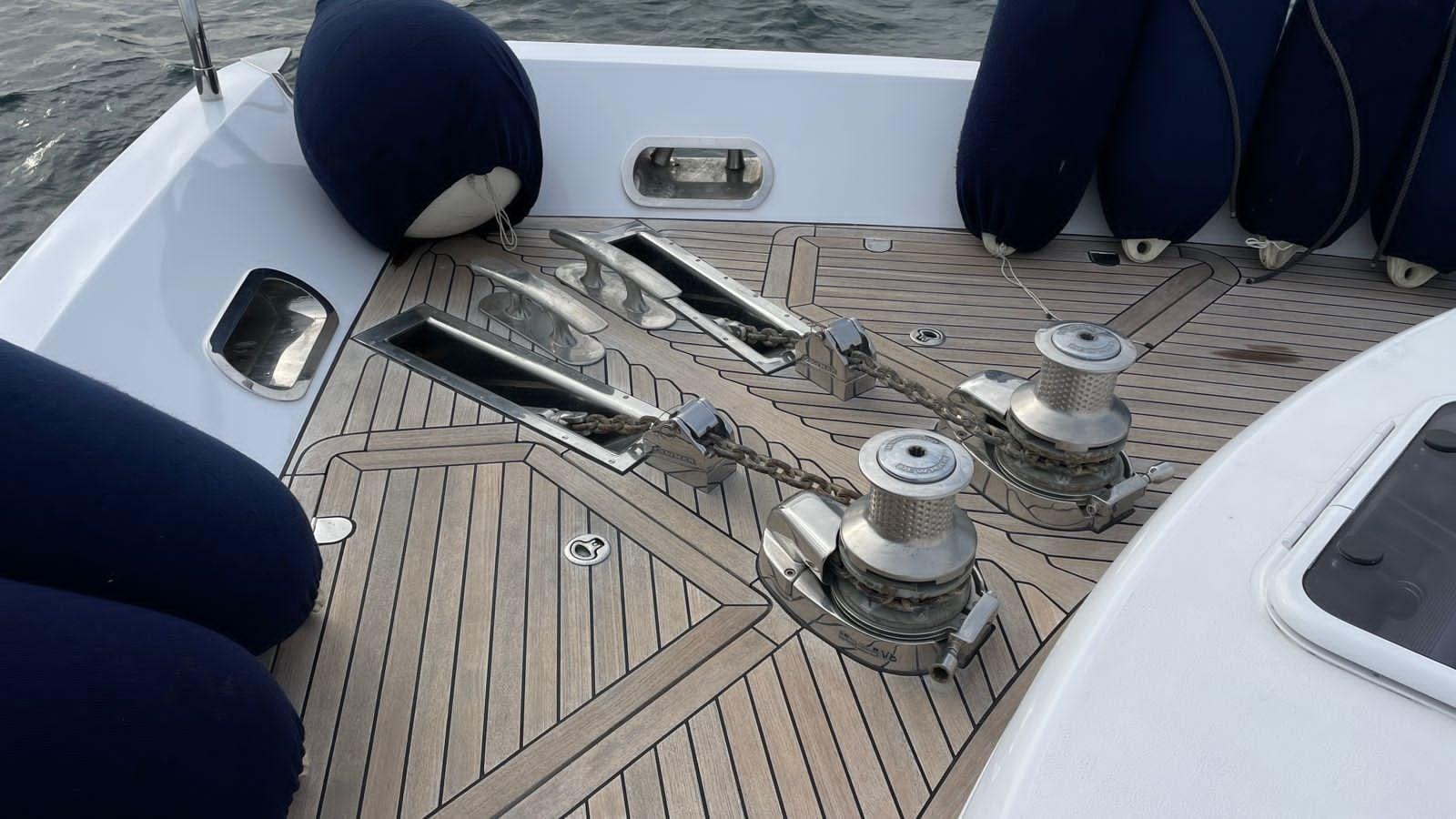 a guitar on a wooden surface aboard PRINCESS 21M Yacht for Sale