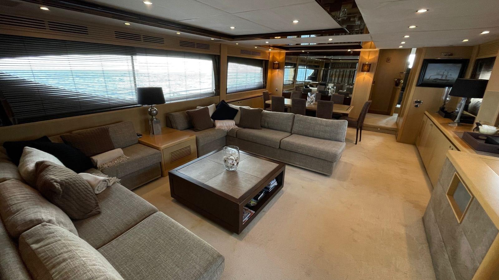a living room with a large window aboard PRINCESS 21M Yacht for Sale