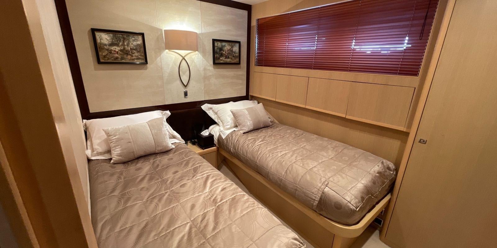 a couple of beds in a room aboard PRINCESS 21M Yacht for Sale
