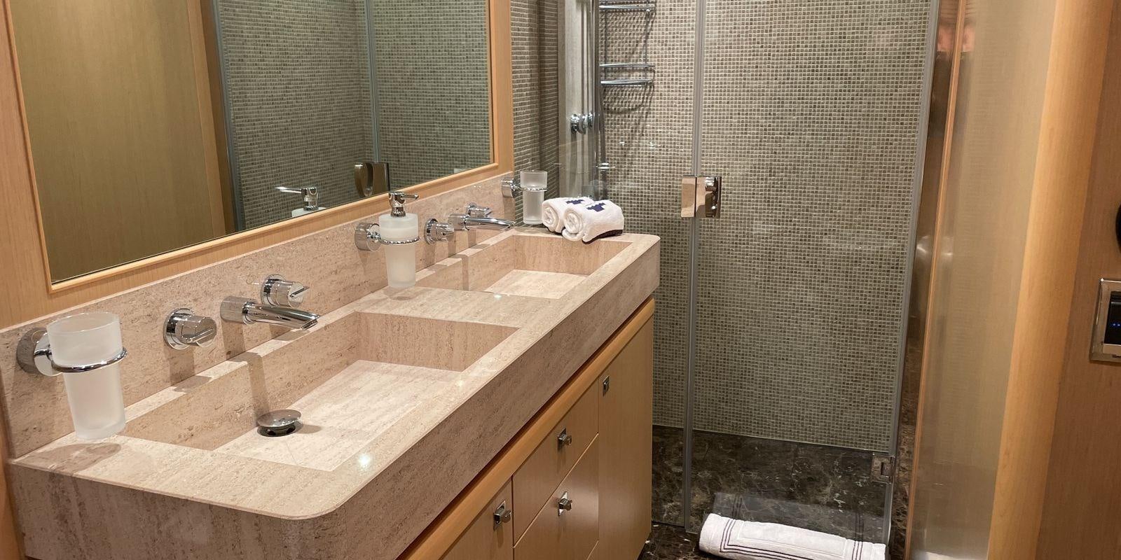 a bathroom with a sink and a mirror aboard PRINCESS 21M Yacht for Sale