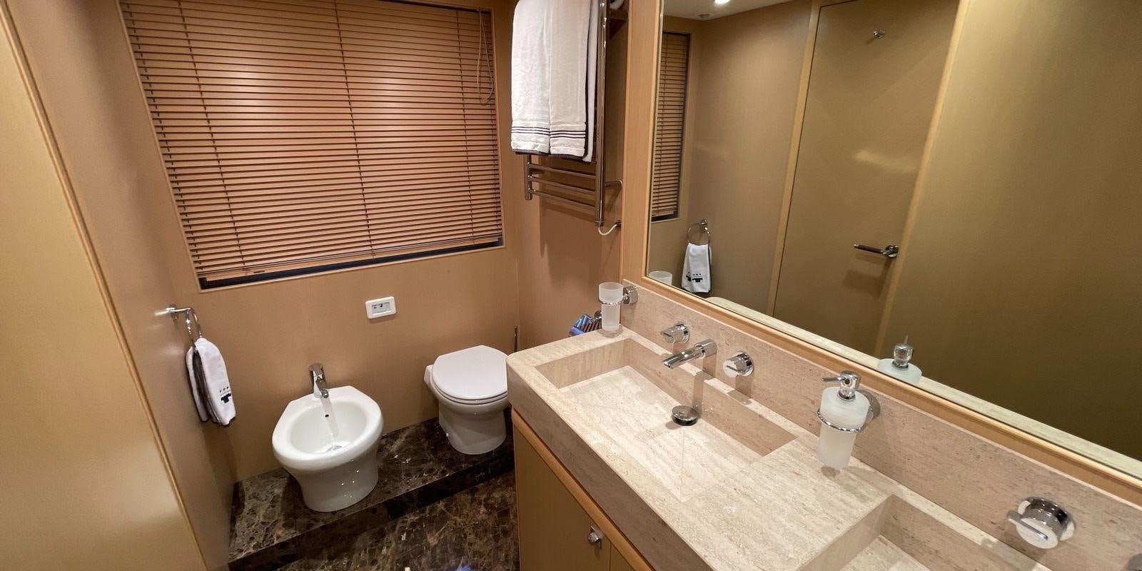a bathroom with a sink and a toilet aboard PRINCESS 21M Yacht for Sale