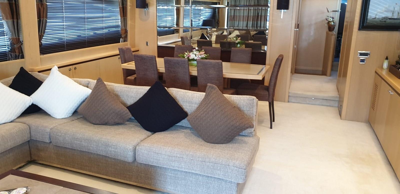 a couch with pillows on it aboard PRINCESS 21M Yacht for Sale