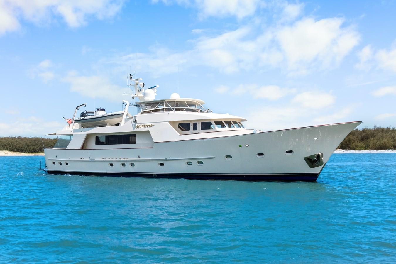 a white yacht in the water aboard HUNTRESS Yacht for Sale