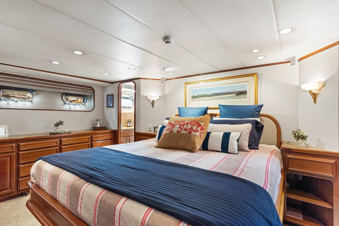 a bedroom with a large bed aboard HUNTRESS Yacht for Sale