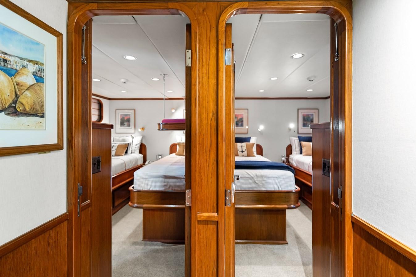 a bedroom with a bed aboard HUNTRESS Yacht for Sale