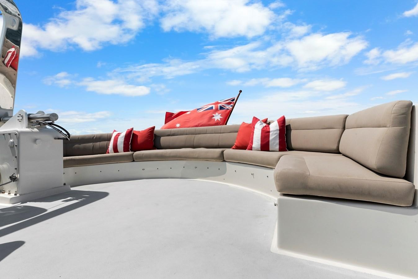 a car with a red and white stripe on the roof aboard HUNTRESS Yacht for Sale