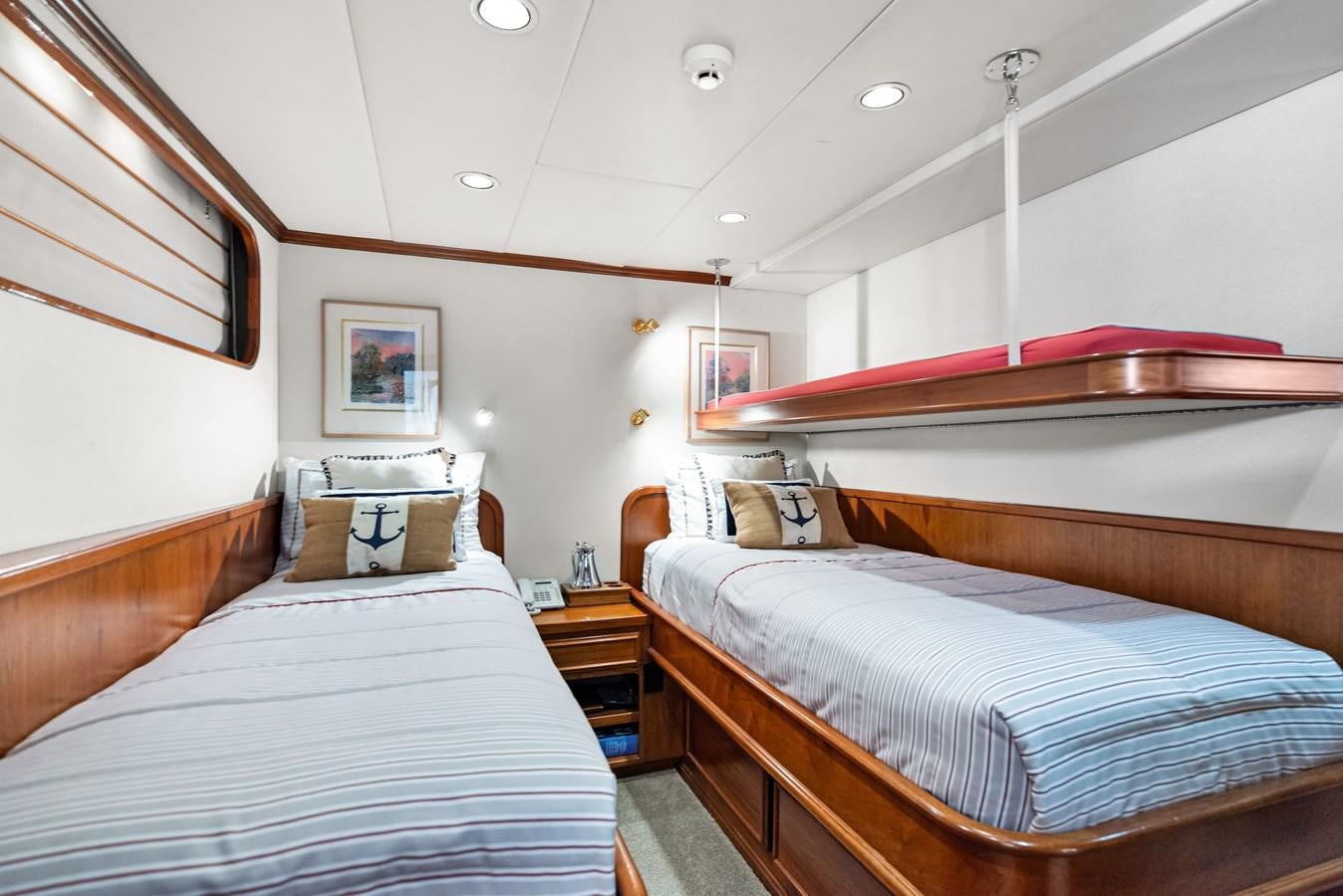 a room with two beds aboard HUNTRESS Yacht for Sale