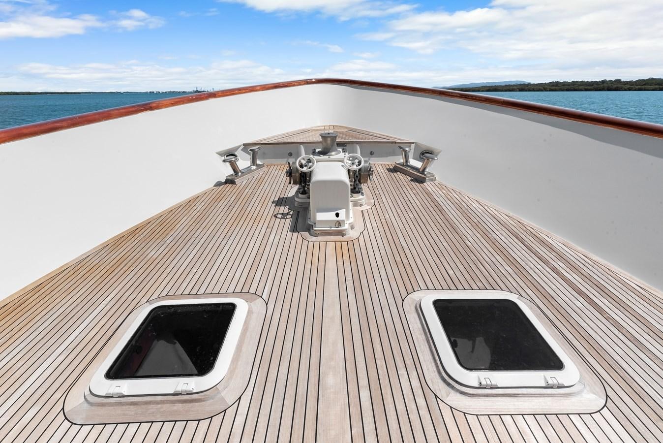 a white car on a boat aboard HUNTRESS Yacht for Sale