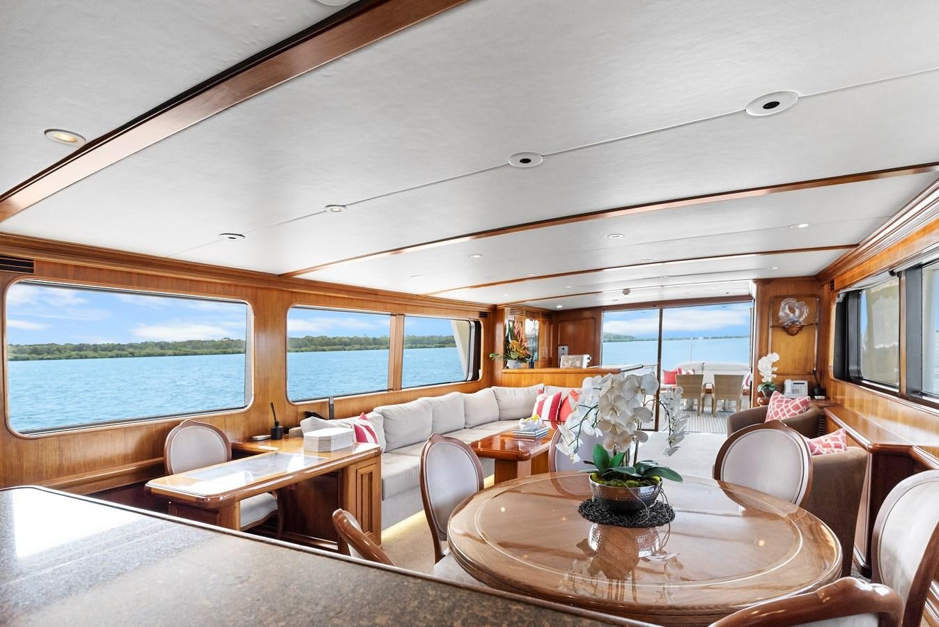 a living room with a large window aboard HUNTRESS Yacht for Sale