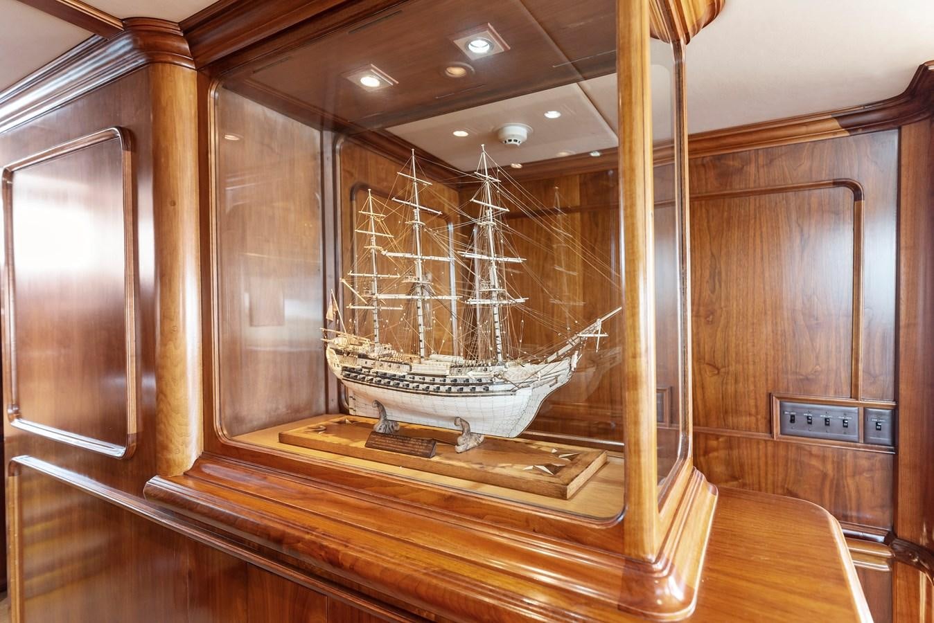 a large sailboat in a wooden room aboard HUNTRESS Yacht for Sale
