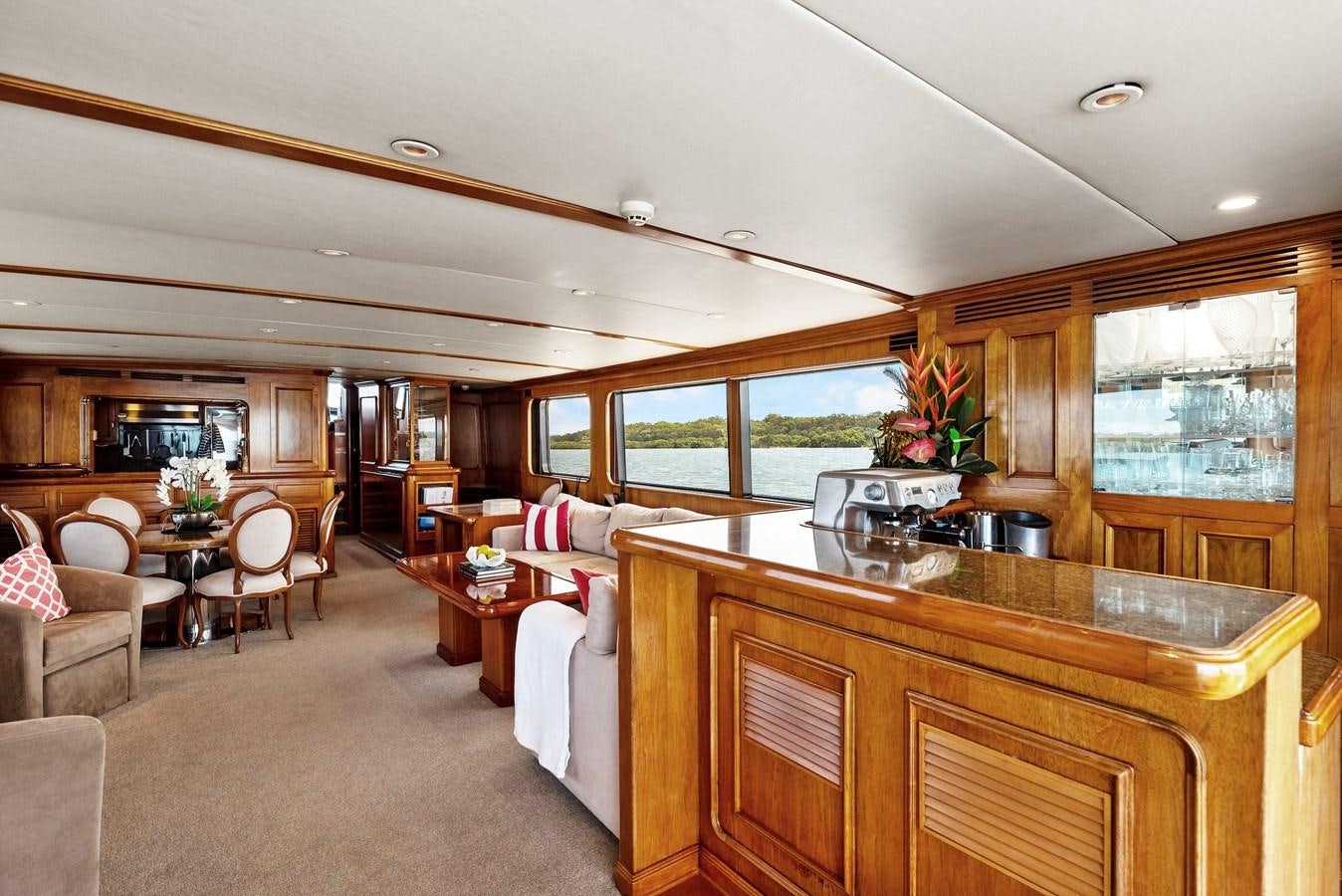 a kitchen with a dining table aboard HUNTRESS Yacht for Sale